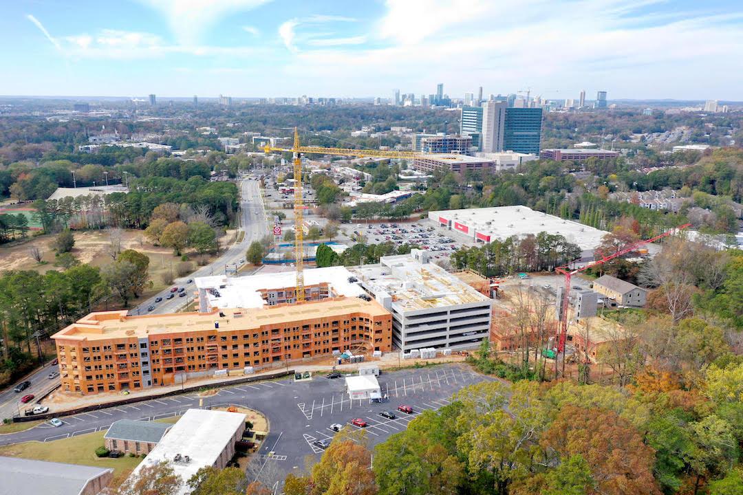 Images Mixeduse Bryn House tops out between parking lots Urbanize